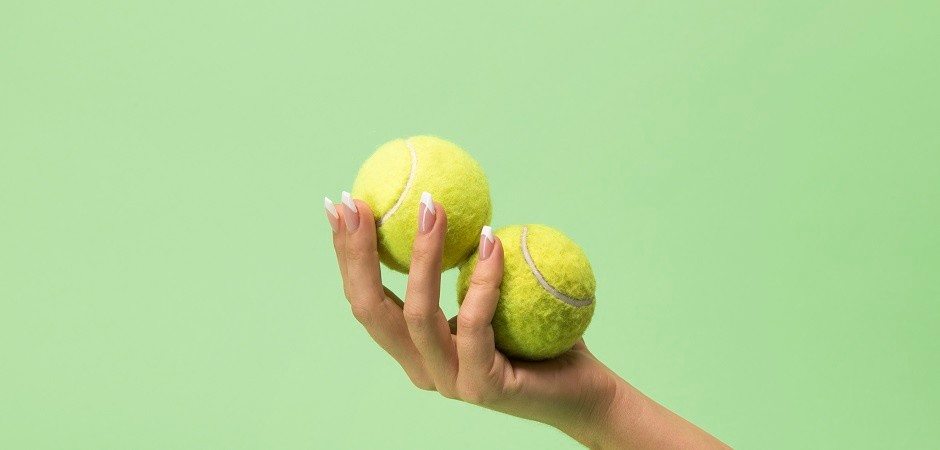 tennis balls hand